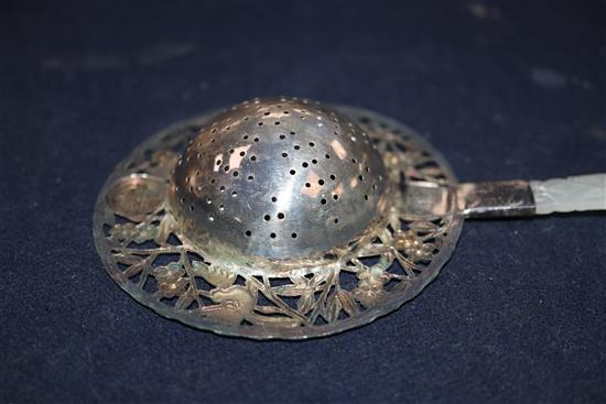 A Chinese white metal and enamel tea strainer, with pierced jade handle, 22cm.